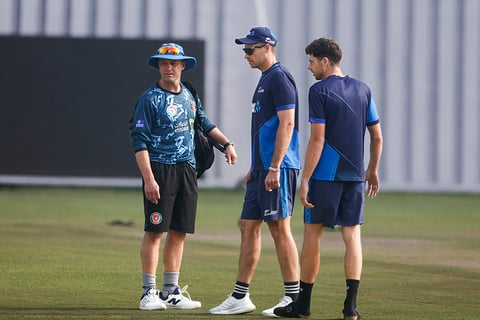 Afghanistan vs New Zealand 1st Test Day 1: Tim Southee, center, and Mitchell Santner, right, interact with Afghanistan's head coach, Jonathan Trott 